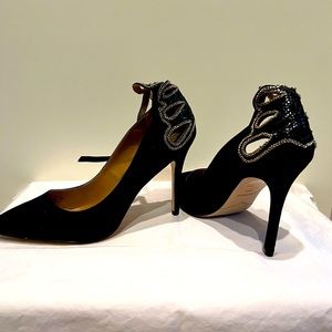 Black suede heels with gold detailing